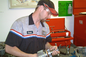 Student working on a car