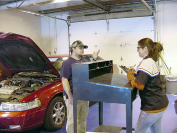 Student working on a car