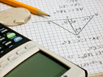 a calculator laying on graph paper