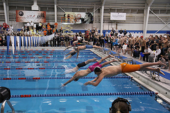 Student athletes dive into the competition in last year's 2014 NAIA Swimming and Diving National Championships. During the 2015 meet, over 400 athletes will compete March 4-7 at the OCCC Aquatic Center. For more information, visit /naia. 