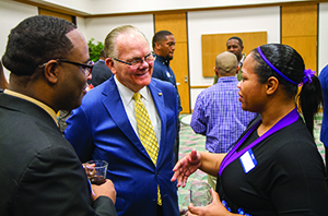 President Steward visits with students and mentors at the reception for the Students Connecting with Mentors for Success program at OCCC.